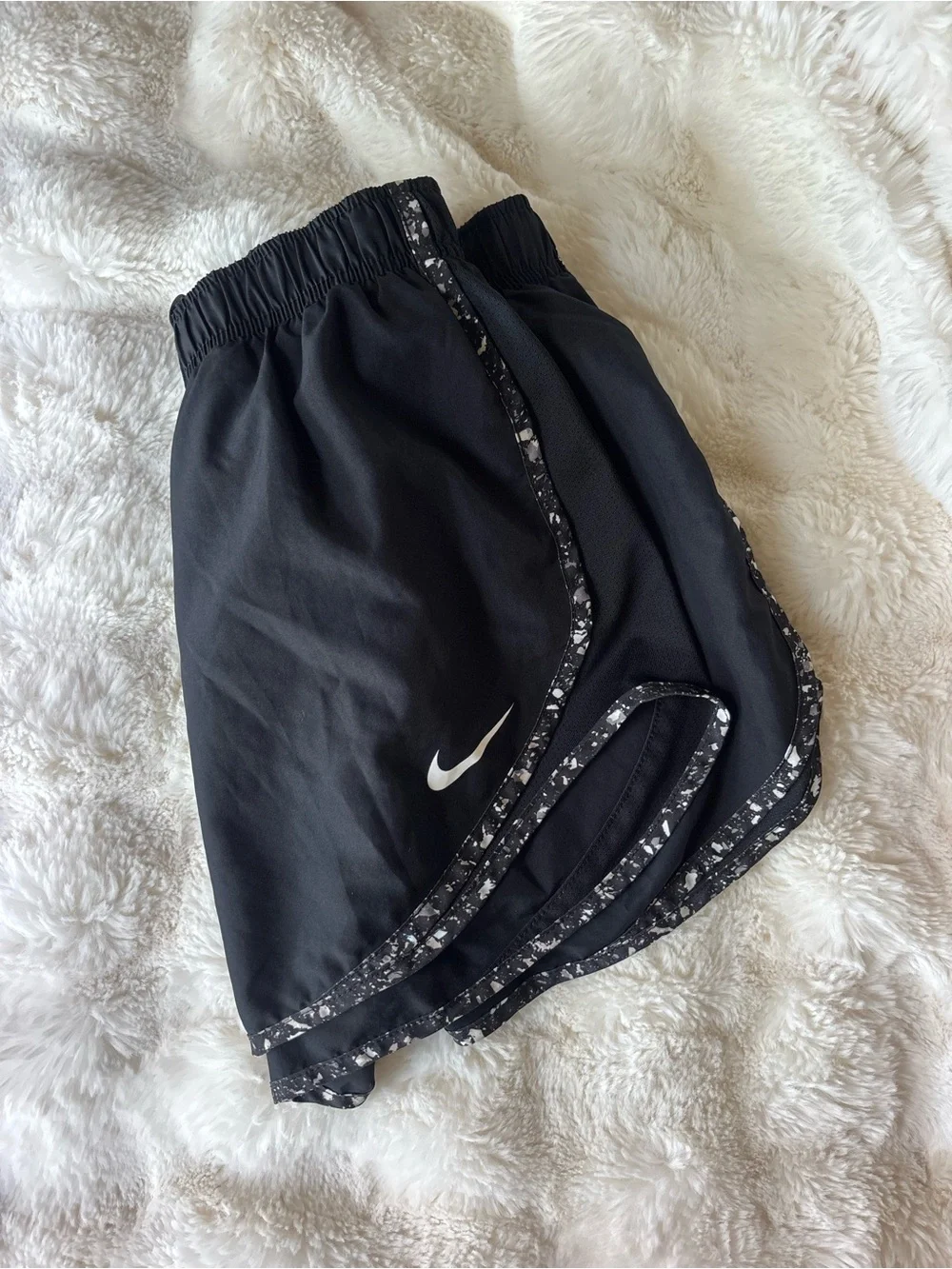 Nike Black Athletic Shorts with White Swoosh and Speckled Trim